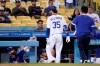Los Angeles Dodgers' Cody Bellinger holds the back of his leg after being taken out of the game during the fifth inning of a baseball game against the Texas Rangers Friday, June 11, 2021, in Los Angeles. (AP Photo/Mark J. Terrill)