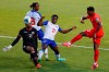 Canada's Jonathan David (20) tries to score against Haiti's Josue Duverger (12) and Bryan Alceus (21) during the first half of a World Cup qualifying soccer match Tuesday, June 15, 2021, in Bridgeview, Ill. (AP Photo/Kamil Krzaczynski)
