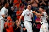 Houston Astros' Jose Altuve (27) celebrates with Chas McCormick (20) and Michael Brantley after hitting a game-winning grand slam during the 10th inning of a baseball game against the Texas Rangers Tuesday, June 15, 2021, in Houston. The Astros won 6-3. (AP Photo/David J. Phillip)
