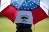 A course official keeps out of the sun on the seventh green during a practice round of the U.S. Open Golf Championship, Tuesday, June 15, 2021, at Torrey Pines Golf Course in San Diego. (AP Photo/Gregory Bull)