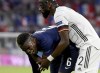 Germany's Antonio Ruediger, right, stands beside France's Paul Pogba during the Euro 2020 soccer championship group F match between France and Germany at the Allianz Arena stadium in Munich, Tuesday, June 15, 2021. (Matthias Hangst/Pool via AP)