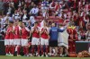 Denmark players react after the collapsing of their teammate Christian Eriksen during the Euro 2020 soccer championship group B match between Denmark and Finland at Parken stadium in Copenhagen, Denmark, Saturday, June 12, 2021. (Friedemann Vogel/Pool via AP)