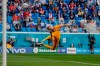 Finland's goalkeeper Lukas Hradecky watches the ball as Russia's Aleksei Miranchuk scores the opening goal of his team during the Euro 2020 soccer championship group B match between Russia and Finland at the Saint Petersburg stadium, in St. Petersburg, Russia, Wednesday, June 16, 2021. (Evgenia Novozhenina/Pool via AP)