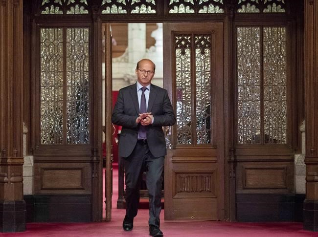 Conservative Sen. Claude Carignan leaves the Senate Chamber on Parliament Hill in Ottawa on June 19, 2018. THE CANADIAN PRESS/Justin Tang