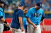 Tampa Bay Rays manager Kevin Cash, center, takes starting pitcher Rich Hill, right, out of the game against the Baltimore Orioles during the fourth inning of a baseball game Saturday, June 12, 2021, in St. Petersburg, Fla. Looking on is catcher Mike Zunino. (AP Photo/Chris O'Meara)