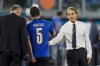 Italy's manager Roberto Mancini, right, shakes hands with Italy's Manuel Locatelli during the Euro 2020 soccer championship group A match between Italy and Switzerland at the Olympic stadium in Rome, Italy, Wednesday, June 16, 2021. (AP Photo/Alessandra Tarantino, Pool)