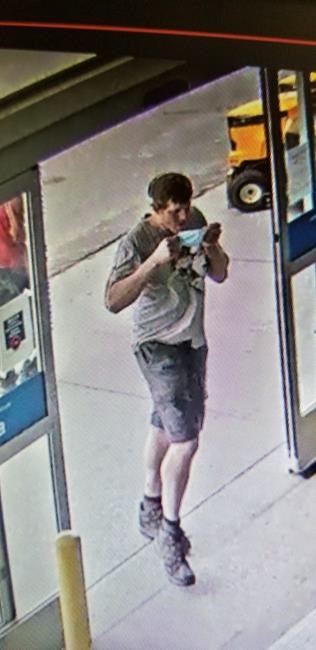 Eric Wildman is shown in this recent surveillance footage. Manitoba RCMP have released details about sightings of a homicide suspect they say is armed and dangerous.  THE CANADIAN PRESS/HO - RCMP