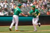 Oakland Athletics' Ramon Laureano is greeted by third base coach Mark Kotsay after hitting a home run in the fourth inning of a baseball game Wednesday, June 16, 2021, in Oakland, Calif. (AP Photo/Eric Risberg)