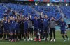 Slovakian players celebrate at the end of the Euro 2020 soccer championship group E match between Poland v Slovakia at the Saint Petersburg stadium in St. Petersburg, Russia, Monday, June 14, 2021. (Evgenya Novozhenina/Pool via AP)