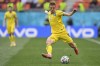 Ukraine's Vitaliy Mykolenko runs with the ball during the Euro 2020 soccer championship group C match between Ukraine and North Macedonia at the National Arena stadium in Bucharest, Romania, Thursday, June 17, 2021. (Justin Setterfield, Pool via AP)