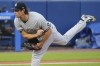 New York Yankees starting pitcher Gerrit Cole watches a throw to a Toronto Blue Jays batter during the first inning of a baseball game Wednesday, June 16, 2021, in Buffalo, N.Y. (AP Photo/Jeffrey T. Barnes)