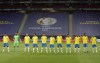 Brazil's players stand during the national anthem prior to a Copa America soccer match against Venezuela at the National Stadium in Brasilia, Brazil, Sunday, June 13, 2021. (AP Photo/Eraldo Peres)