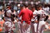Arizona Diamondbacks manager Torey Lovullo, front center, talks with from left to right, Carson Kelly, Nick Ahmed, Josh Rojas and Christian Walker during a pitching change in the third inning of a baseball game against the San Francisco Giants, Thursday, June 17, 2021, in San Francisco. (AP Photo/Eric Risberg)