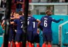 France's Paul Pogba, right, celebrates after Karim Benzema scored a goal, which was later disallowed, during the Euro 2020 soccer championship group F match between France and Germany at the Allianz Arena in Munich, Germany, Tuesday, June 15, 2021. (AP Photo/Matthias Schrader, Pool)