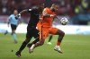 Memphis Depay of the Netherlands, right, and Austria's David Alaba vie for the ball during the Euro 2020 soccer championship group C match between Netherlands and Austria at Johan Cruyff ArenA in Amsterdam, Netherlands, Thursday, June 17, 2021, (Dean Mouhtaropoulous/Pool via AP)