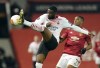 FILE - In this Thursday, March 11, 2021 file photo, AC Milan's Fikayo Tomori, left, and Manchester United's Anthony Martial challenge for the ball during their Europa League round of 16 first leg soccer match at Old Trafford in Manchester, England. AC Milan has exercised its option to sign Fikayo Tomori from Chelsea after the defender’s loan spell with the Italian club in the second half of the season, it was announced Friday, June 18. The Serie A club paid a reported fee of at least $33 million for the 23-year-old Tomori. (AP Photo/Dave Thompson)