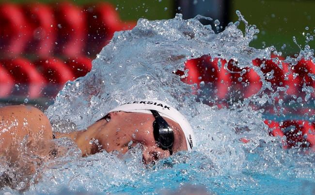 Canada's Penny Oleksiak competes in women's 100m freestyle during the 2018 Commonwealth Games on the Gold Coast, Australia, Sunday, April 8, 2018. The Olympic swim trials start Saturday in Toronto's Pan Am Sports Centre after cancellation in 2020 and a pair of postponements in 2021 because of the COVID-19 pandemic. THE CANADIAN PRESS/AP-Rick Rycroft