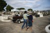 Relatives accompany the coffin that contains the remains of 89-year-old Irodina Pinto Ribeiro, who died from COVID-19 related complications, at the Inhauma cemetery in Rio de Janeiro, Brazil, Friday, June 18, 2021. Brazil is approaching an official COVID-19 death toll of 500,000 — second-highest in the world. (AP Photo/Bruna Prado)