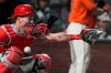 Philadelphia Phillies catcher Andrew Knapp is hit on the face mask by a pitch during the sixth inning of the team's baseball game against the San Francisco Giants on Friday, June 18, 2021, in San Francisco. (AP Photo/Tony Avelar)