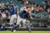Tampa Bay Rays catcher Francisco Mejia throws out Seattle Mariners' Luis Torrens at first on a grounder as pitcher Andrew Kittredge, left, watches during the fifth inning of a baseball game Friday, June 18, 2021, in Seattle. (AP Photo/Ted S. Warren)