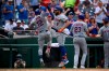 New York Mets' Francisco Lindor (12) celebrates his two-run home run with Dominic Smith (2) during the fifth inning of the first baseball game of a doubleheader, Saturday, June 19, 2021, in Washington. This is a makeup of a postponed game from April 1. (AP Photo/Nick Wass)