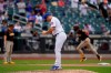 New York Mets relief pitcher Jacob Barnes, center, reacts after giving up a grand slam to San Diego Padres' Fernando Tatis Jr., right, during the seventh inning of a baseball game at Citi Field, Sunday, June 13, 2021, in New York. (AP Photo/Seth Wenig)