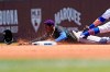 Miami Marlins' Jazz Chisholm Jr., left, steals second as Chicago Cubs second baseman Eric Sogard applies a late tag during the first inning of a baseball game in Chicago, Saturday, June 19, 2021. (AP Photo/Nam Y. Huh)