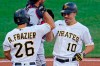 Pittsburgh Pirates' Bryan Reynolds (10) celebrates with Adam Frazier (26) after hitting a three-run home run off Cleveland Indians relief pitcher James Karinchak during the seventh inning of a baseball game in Pittsburgh, Saturday, June 19, 2021. (AP Photo/Gene J. Puskar)