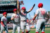 Philadelphia Phillies' Rhys Hoskins, second from right, celebrates after hitting a three-run home run that also scored Ronald Torreyes, left, and Luke Williams, second from left, during the seventh inning of a baseball game against the San Francisco Giants in San Francisco, Saturday, June 19, 2021. Phillies' J.T. Realmuto, right, looks on. (AP Photo/Jeff Chiu)