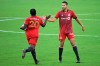 Toronto FC forward Ayo Akinola (20) is congratulated by defender Omar Gonzalez (44) after Akinola scored a goal during the first half of the team's MLS soccer match against Orlando City, Saturday, June 19, 2021, in Orlando, Fla. (AP Photo/Phelan M. Ebenhack)
