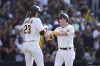 San Diego Padres' Jake Cronenworth, right, celebrates with Fernando Tatis Jr. (23) after hitting a two-run home run that scored them in the third inning of a baseball game against the Cincinnati Reds, Saturday, June 19, 2021, in San Diego. (AP Photo/Derrick Tuskan)