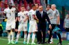 Belgium's manager Roberto Martinez speaks to Youri Tielemans after the goal of his team during the Euro 2020 soccer championship group B match between Denmark and Belgium at Parken stadium in Copenhagen, Denmark, Thursday, June 17, 2021. (AP Photo/Martin Meissner, Pool)