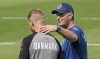 Denmark's captain Simon Kjaer, left, gets touched on the shoulder by Denmark's manager Kasper Hjulmand during a training session at the training ground in Helsingor, Denmark, Sunday, June 20, 2021 the day before the Euro 2020 soccer championship group B match between Denmark and Russia. (AP Photo/Martin Meissner)