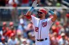 Washington Nationals' Kyle Schwarber celebrates his home run during the fifth inning of a baseball game against the New York Mets, Sunday, June 20, 2021, in Washington. (AP Photo/Nick Wass)