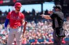 Philadelphia Phillies' Bryce Harper, left, looks at home plate umpire Greg Gibson, right, as he is called out on strikes during the sixth inning against the San Francisco Giants during a baseball game Sunday, June 20, 2021, in San Francisco. (AP Photo/Tony Avelar)