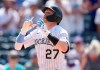 Colorado Rockies' Trevor Story gestures as he crosses home plate after hitting a solo home run off Milwaukee Brewers starting pitcher Eric Lauer in the sixth inning of a baseball game Sunday, June 20, 2021, in Denver. (AP Photo/David Zalubowski)