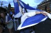 Scotland fans celebrate the Euro 2020 soccer championship group D match between England and Scotland, held at London's Wembley stadium, in Glasgow, Scotland, Friday, June 18, 2021. (Robert Perry/PA via AP)