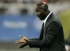 FILE - In this file photo dated Tuesday, Aug. 19, 2008, Nigeria's head coach Samson Siasia directs his players during a men's semifinal soccer match against Belgium at the Beijing 2008 Olympics in Shanghai. The soccer coach who led Nigeria to win two Olympic medals had his life ban by FIFA in a match-fixing case cut to five years. The Court of Arbitration for Sport's judges say a life ban for Samson Siasia was “disproportionate” for a passive offense which didn't earn him any money. FIFA had expelled Siasia in 2019 for his past links to Singaporean match-fixer Wilson Perumal.(AP Photo/Eugene Hoshiko, File)