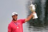 Jon Rahm, of Spain, holds the champions trophy for photographers after the final round of the U.S. Open Golf Championship, Sunday, June 20, 2021, at Torrey Pines Golf Course in San Diego. (AP Photo/Jae C. Hong)