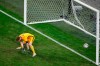 Finland's goalkeeper Lukas Hradecky fails to save the ball as Belgium's Romelu Lukaku scores his side's second goal during the Euro 2020 soccer championship group B match between Finland and Belgium at Saint Petersburg Stadium in St. Petersburg, Russia, Monday, June 21, 2021. (Anton Vaganov/Pool Photo via AP)