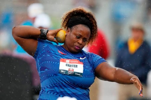 FILE - Michelle Carter sets to throw during the women's shot put at the U.S. Championships athletics meet in Des Moines, Iowa, in this Sunday, July 28, 2019, file photo. Reigning Olympic shot put champion Michelle Carter won't compete at the U.S. track and field trials after having a benign tumor removed from her right ankle. The 35-year-old will cheer on her friends and fellow competitors. (AP Photo/Charlie Neibergall, File)