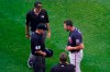 Atlanta Braves starter Kyle Muller, right, reacts as third base umpire Ron Kulpa (46) asks to see what is beneath his belt after he pitched during the first inning of a baseball game against the New York Mets, Monday, June 21, 2021, in New York. (AP Photo/Kathy Willens)