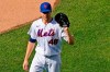 New York Mets starting pitcher Jacob deGrom shows his glove to the home plate umpire before taking the mound during the first inning of a baseball game against the Atlanta Braves, Monday, June 21, 2021, in New York. (AP Photo/Kathy Willens)