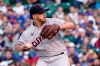 Cleveland Indians starting pitcher Aaron Civale winds up during the first inning of a baseball game against the Chicago Cubs, Monday, June 21, 2021, in Chicago. (AP Photo/Charles Rex Arbogast)