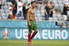 Portugal's Cristiano Ronaldo leaves the field at the end of the Euro 2020 soccer championship group F match between Portugal and Germany at the Football Arena stadium in Munich, Germany, Saturday, June 19, 2021. Germany won 4-2. (Philipp Guelland/Pool via AP)