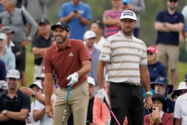 Sergio Garcia, of Spain, left, watches his shot on the 15th tee as Bubba Watson looks on during the second round of the U.S. Open Golf Championship, Friday, June 18, 2021, at Torrey Pines Golf Course in San Diego. (AP Photo/Jae C. Hong)