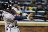 Atlanta Braves' Dansby Swanson follows through on a three-run home run during the third inning of a baseball game against the New York Mets Tuesday, June 22, 2021, in New York. (AP Photo/Frank Franklin II)