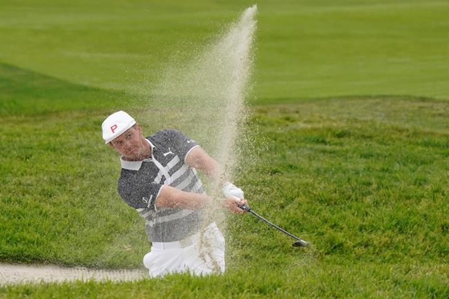 Bryson DeChambeau plays a shot from a bunker on the 13th hole during the final round of the U.S. Open Golf Championship, Sunday, June 20, 2021, at Torrey Pines Golf Course in San Diego. (AP Photo/Marcio Jose Sanchez)