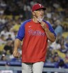 Manager Joe Girardi of the Philadelphia Phillies smiles as talks with Albert Pujols (not pictured) of the Los Angeles Dodgers in the sixth inning of a baseball game at Dodger Stadium in Los Angeles on Tuesday, June 15, 2021. (Keith Birmingham/The Orange County Register via AP)