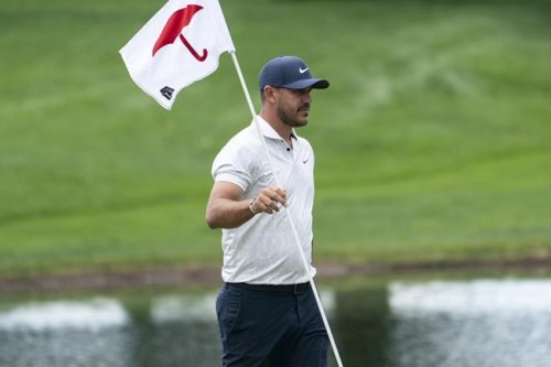Brooks Koepka walks along the eighth green after putting during the pro-am ahead of the Travelers Championship golf tournament at TPC River Highlands, Wednesday, June 23, 2021, in Cromwell, Conn. (AP Photo/John Minchillo)